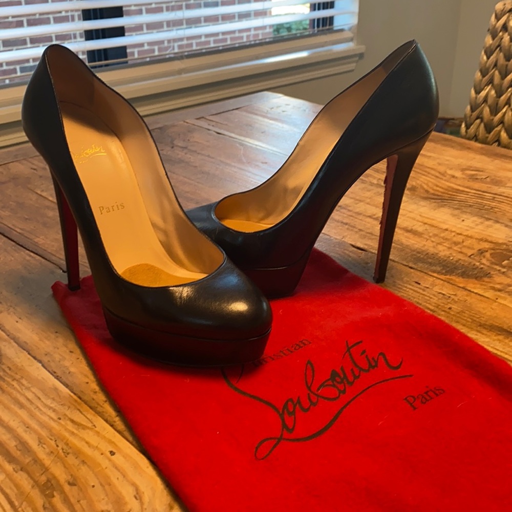 Christian Louboutin black leather, round toe, platform pump. Size 40. 120mm.